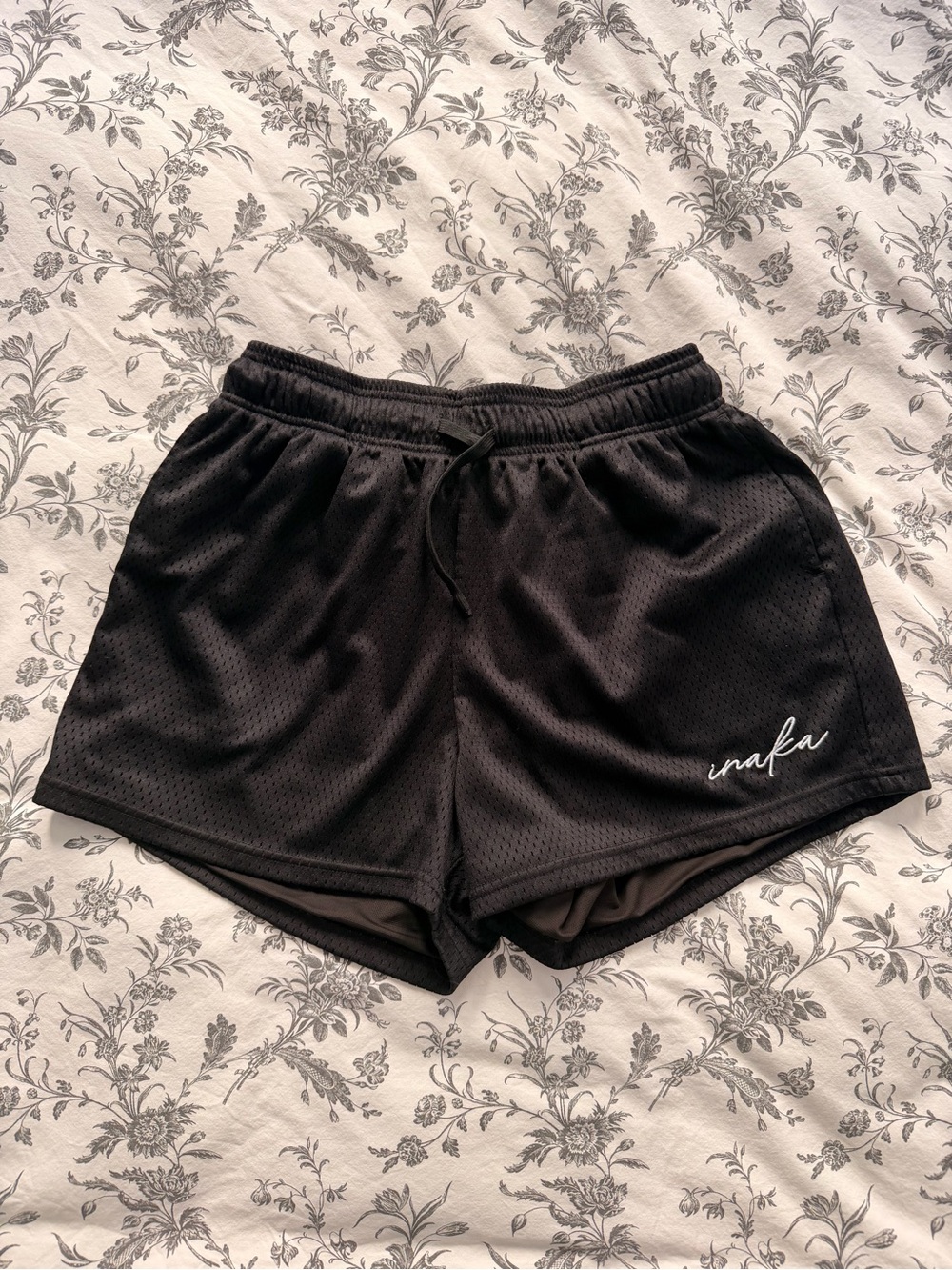 Inaka Power Black Mesh Athletic Shorts with White Script